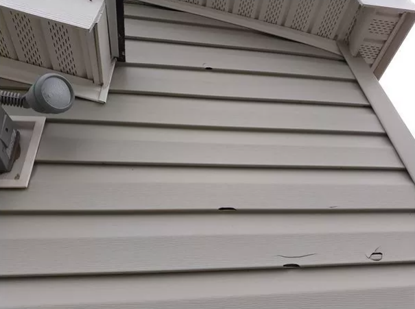 Exterior siding repair by Affordable Handyman NWA in Bentonville Arkansas